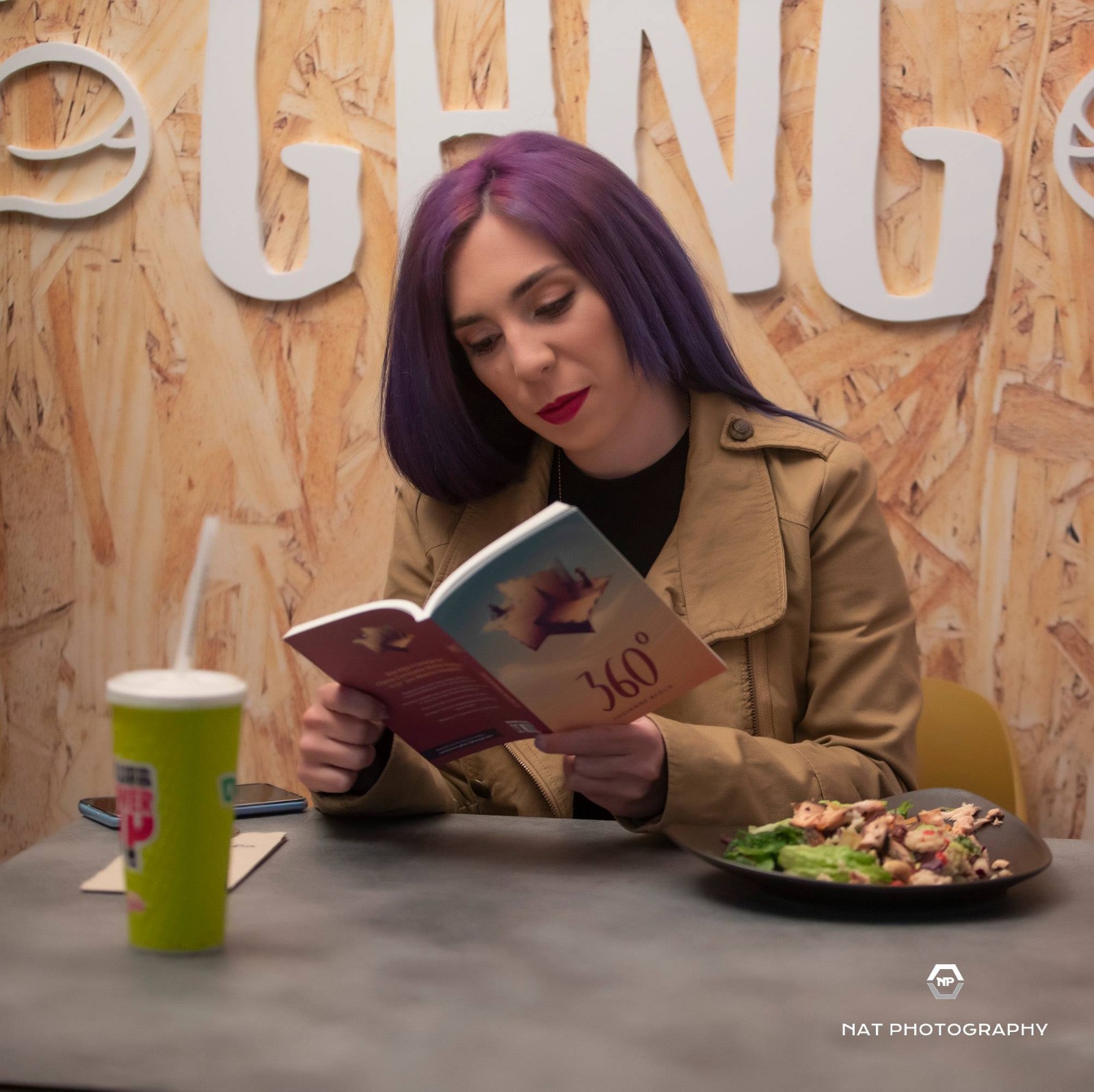 josianne block reading her book 360° while eating and drinking dr juice